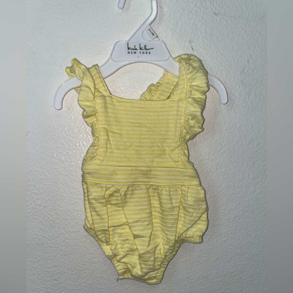 3 newborn summer one pieces. Never worn. Brand new condition.